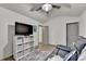 Versatile bonus room space with a ceiling fan, entertainment center, and comfortable seating at 127 Bradshaw Park Dr, Woodstock, GA 30188
