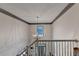 Bright foyer featuring a stunning chandelier and large window, complementing the staircase and entryway at 127 Bradshaw Park Dr, Woodstock, GA 30188