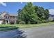 Charming two-story home with a well-manicured lawn and mature trees in a quiet neighborhood setting at 127 Bradshaw Park Dr, Woodstock, GA 30188