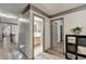 Hallway showcasing gray trim, doors, and an opening into a bathroom, creating a bright and airy space at 127 Bradshaw Park Dr, Woodstock, GA 30188