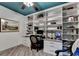 Home office with built-in shelves and desk, providing an ideal work-from-home setting at 127 Bradshaw Park Dr, Woodstock, GA 30188