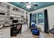 Study with large built-in bookshelves, hardwood floors, and natural light at 127 Bradshaw Park Dr, Woodstock, GA 30188