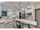 Bright white kitchen featuring an island with marble countertop and pendant lighting at 127 Bradshaw Park Dr, Woodstock, GA 30188