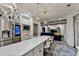 Open kitchen with stainless appliances, marble counters, and an island bar at 127 Bradshaw Park Dr, Woodstock, GA 30188