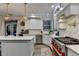 Bright white kitchen with stainless steel appliances, a large island, and backyard access at 127 Bradshaw Park Dr, Woodstock, GA 30188