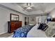 Primary bedroom featuring tray ceilings, natural light from the windows, and decorative sliding barn door at 127 Bradshaw Park Dr, Woodstock, GA 30188