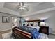 Stately main bedroom featuring tray ceilings, recessed lighting and a decorative rug at 127 Bradshaw Park Dr, Woodstock, GA 30188