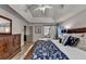 Main bedroom with tray ceilings, recessed lights, natural light and decorative sliding barn door at 127 Bradshaw Park Dr, Woodstock, GA 30188