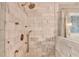 Walk-in shower offering marble tile and modern fixtures at 127 Bradshaw Park Dr, Woodstock, GA 30188