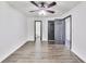 Bedroom with new floors, contemporary fan and lighting, and two entry doors at 131 Turning Point, Stockbridge, GA 30281