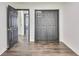 Hallway with laminate flooring, closet, and neutral paint tones creating an open feel at 131 Turning Point, Stockbridge, GA 30281