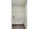 This laundry room features hardwood floors and a wire rack for storage at 131 Turning Point, Stockbridge, GA 30281