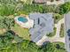 Expansive estate with meticulously landscaped grounds, featuring an in-ground pool, large driveway, and mature trees at 3090 Creek Tree Lane, Cumming, GA 30041