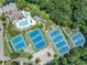 Aerial view of community amenities including tennis courts, pool, clubhouse, playground, and basketball court at 3090 Creek Tree Lane, Cumming, GA 30041