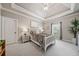 Stylish bedroom with tray ceilings, large windows, and sophisticated decor creating a serene atmosphere at 3090 Creek Tree Lane, Cumming, GA 30041