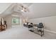 Expansive bonus room complete with vaulted ceiling, ceiling fan, and designated office space at 3090 Creek Tree Lane, Cumming, GA 30041