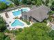 Aerial view of a community clubhouse with swimming pools and recreational facilities, perfect for leisure and social gatherings at 3090 Creek Tree Lane, Cumming, GA 30041