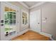 Entryway with hardwood floors and access to the backyard through French door at 3090 Creek Tree Lane, Cumming, GA 30041