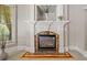 Close-up of the living room fireplace with decorative mantle and marble accents at 3090 Creek Tree Lane, Cumming, GA 30041