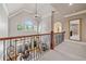 Lovely foyer overlooking the living area with iron railings, arched windows, and an open layout at 3090 Creek Tree Lane, Cumming, GA 30041