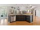 Spacious kitchen features dark wood cabinets, stainless steel appliances, and granite countertops at 3090 Creek Tree Lane, Cumming, GA 30041