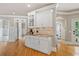 Bright kitchen with white cabinets, granite countertops, and tiled backsplash at 3090 Creek Tree Lane, Cumming, GA 30041