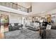 Large living room area showcases hardwood flooring, an open floor plan, and a balcony view at 3090 Creek Tree Lane, Cumming, GA 30041