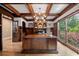 Well-appointed office with dark wood paneling, custom built-ins, and a large executive desk at 3090 Creek Tree Lane, Cumming, GA 30041