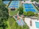 Aerial view of the community tennis courts, playground, basketball court, picnic pavilion and pool at 3090 Creek Tree Lane, Cumming, GA 30041