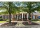 Elegant clubhouse with a brick facade, manicured landscaping, and welcoming entrance at 11715 Dancliff Trce, Alpharetta, GA 30009