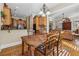 Bright dining area adjacent to the kitchen, featuring a wooden table and views of the inviting living space at 11715 Dancliff Trce, Alpharetta, GA 30009