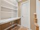 Office featuring built in bookshelves, cabinets, and a desktop area at 11715 Dancliff Trce, Alpharetta, GA 30009