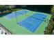 Well-maintained community tennis courts with professional surfacing and well-lit for evening play at 11715 Dancliff Trce, Alpharetta, GA 30009
