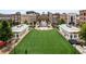 Inviting town center featuring a well-manicured green space, surrounded by shops and apartments at 11715 Dancliff Trce, Alpharetta, GA 30009