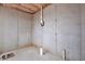 Unfinished basement featuring concrete walls and floor, and exposed ceiling with insulation at 257 Martin Ln, Canton, GA 30114