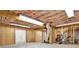 Partially finished basement with wood paneling, exposed ductwork, and utilities at 257 Martin Ln, Canton, GA 30114