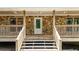 Close up of front door and porch, featuring stone siding and wood railings at 257 Martin Ln, Canton, GA 30114