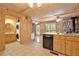 Spacious kitchen area includes an in-unit laundry and leads to a view of the living area and patio at 257 Martin Ln, Canton, GA 30114