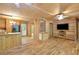 A large living space with wooden floors, walls, and a view into the kitchen at 257 Martin Ln, Canton, GA 30114