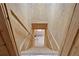 An interior staircase leads down to a lower level with wood paneling and a handrail at 257 Martin Ln, Canton, GA 30114