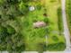 Aerial view showcases the property's spacious lot, lush greenery, and proximity to the road at 4380 Highway 138, Oxford, GA 30054