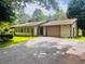 Charming single-story home featuring a private driveway and attached garage at 4380 Highway 138, Oxford, GA 30054