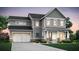 Charming two-story home with gray siding, a covered porch, and a two-car garage at 4835 Wayt Farm Overlook, Cumming, GA 30040