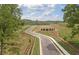 Street view featuring landscaping and winding roads at 4835 Wayt Farm Overlook, Cumming, GA 30040