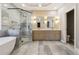 Modern bathroom featuring a glass enclosed shower, and double vanity with stone countertops and sleek mirrors at 7160 Fawn Lake Dr, Alpharetta, GA 30005