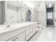 Bright bathroom features a double sink vanity and tiled shower at 7160 Fawn Lake Dr, Alpharetta, GA 30005