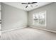 Bedroom with neutral tones, carpet flooring, and a ceiling fan at 7160 Fawn Lake Dr, Alpharetta, GA 30005