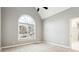 Bedroom with a high ceiling and a large window with a view of the pool at 7160 Fawn Lake Dr, Alpharetta, GA 30005