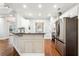 Modern kitchen features stainless steel appliances, granite countertops, and ample cabinet space at 7160 Fawn Lake Dr, Alpharetta, GA 30005