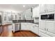 Bright kitchen featuring modern stainless steel appliances and granite countertops at 7160 Fawn Lake Dr, Alpharetta, GA 30005